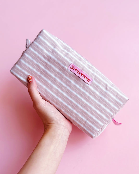 very handy and roomy pastel brown striped zip pouch for make up and camera