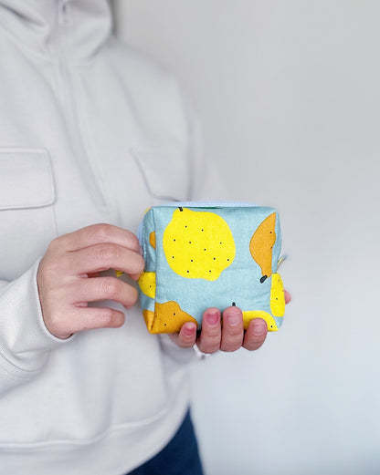 Handmade citrus print mini pouch with soft quilted padding, lemon and orange fabric bag for coins and small essentials.