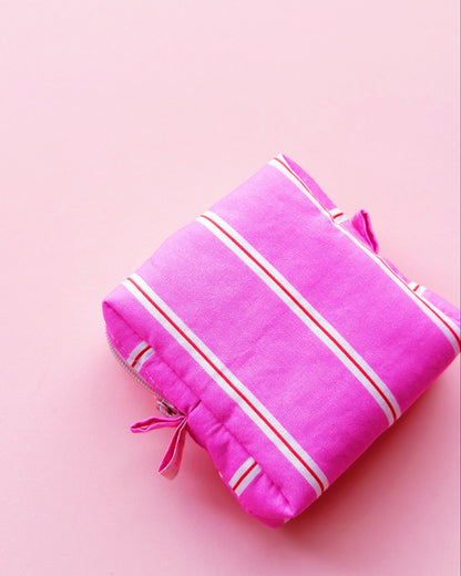 a boxy shape zipper pouch in pink striped fabric