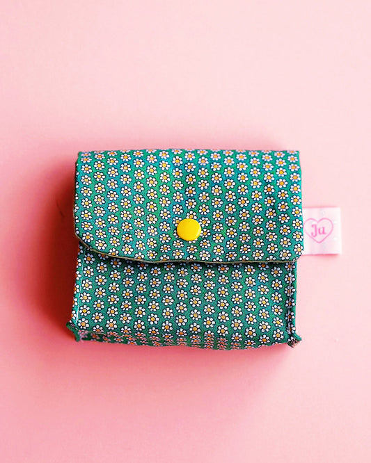 a handmade green liberty cotton fabric made snap button pouch