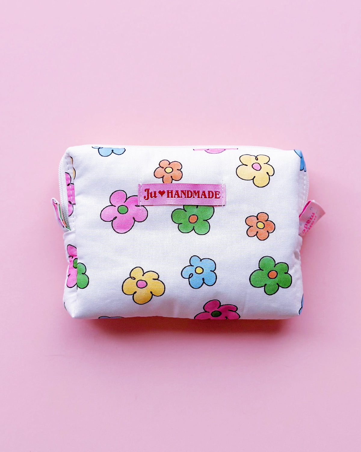 a rectangle shape zipper pouch in colorful daisy print