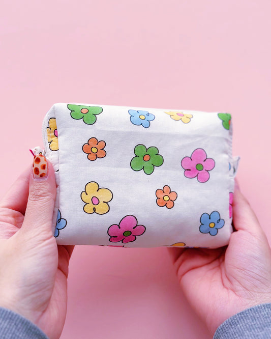 a rectangle shape zipper pouch in colorful daisy print