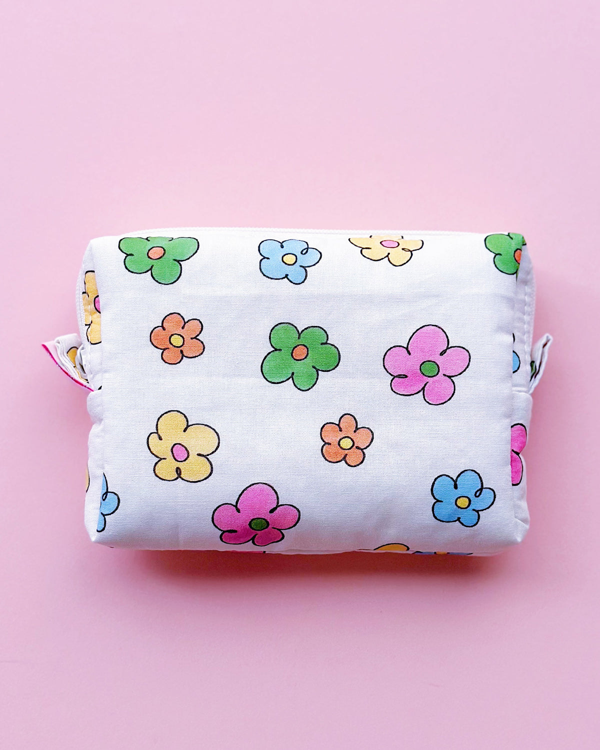 a rectangle shape zipper pouch in colorful daisy print