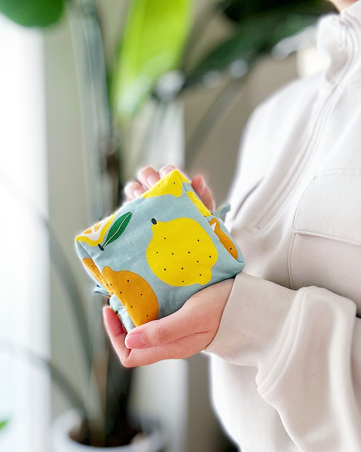 Handmade citrus print mini pouch with soft quilted padding, lemon and orange fabric bag for coins and small essentials.