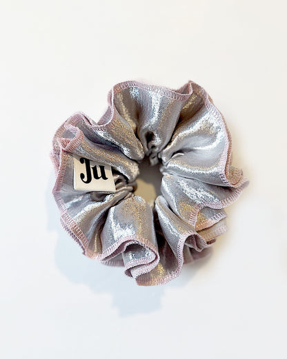Oversized silver satin scrunchie with soft pink edges, shiny metallic hair accessory for Christmas party or festive hairstyles.