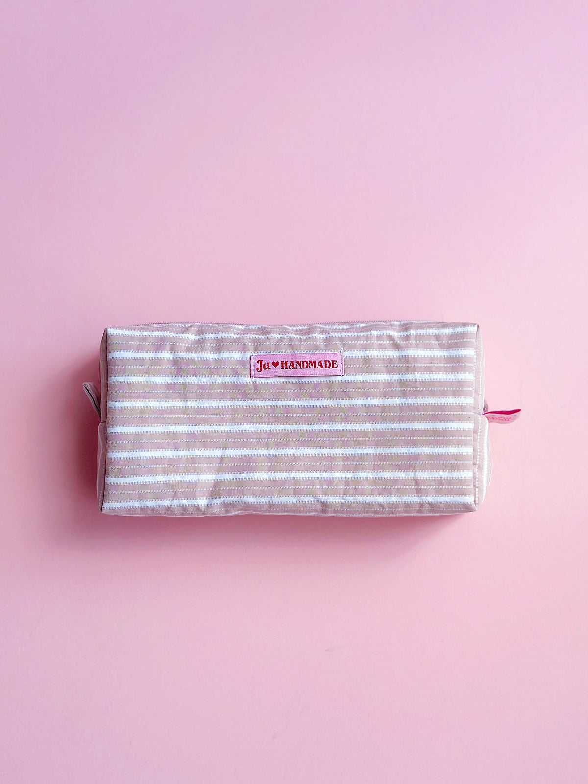 very handy and roomy pastel brown striped zip pouch for make up and camera 