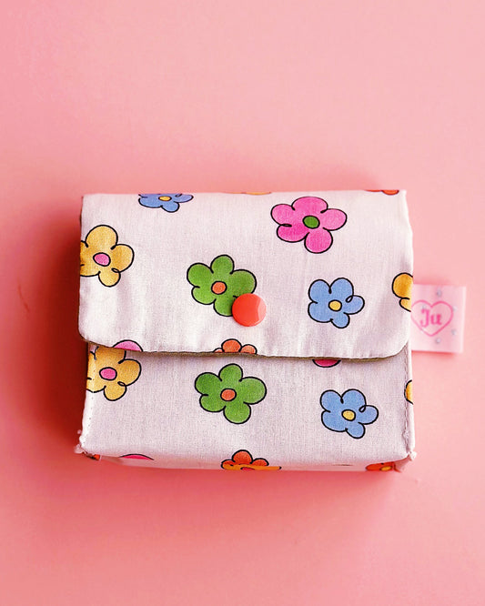 a colorful hand-drawing feel daisy pouch with contrasting snap button.
