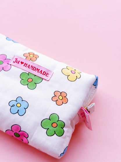 a rectangle shape zipper pouch in colorful daisy print