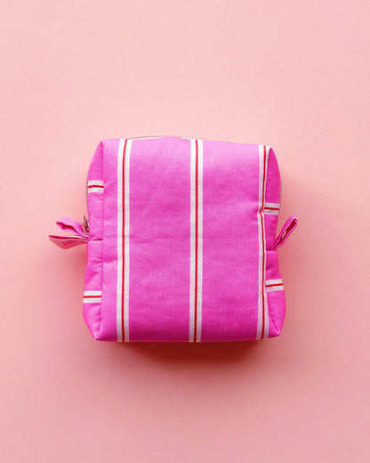 a boxy shape zipper pouch in pink striped fabric