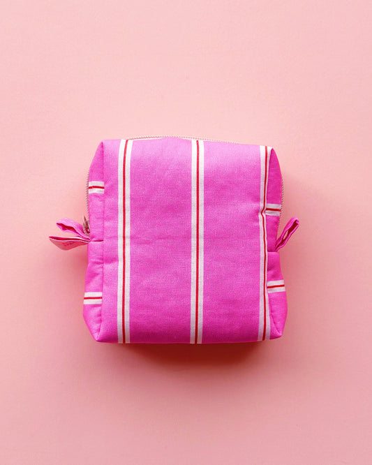 a boxy shape zipper pouch in pink striped fabric