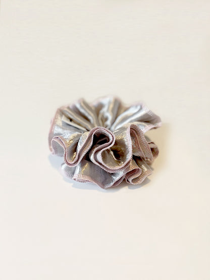 Oversized silver satin scrunchie with soft pink edges, shiny metallic hair accessory for Christmas party or festive hairstyles.