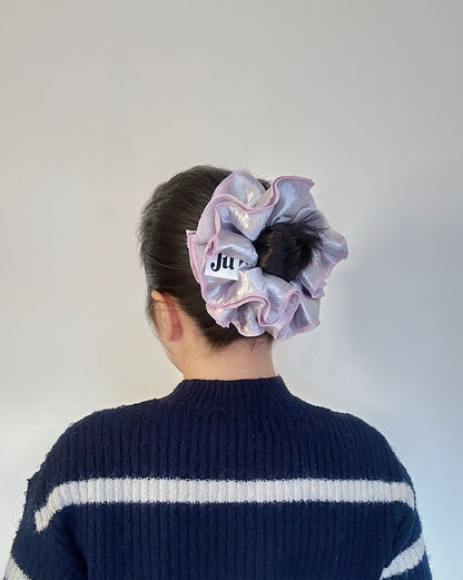 Oversized silver satin scrunchie with soft pink edges, shiny metallic hair accessory for Christmas party or festive hairstyles.