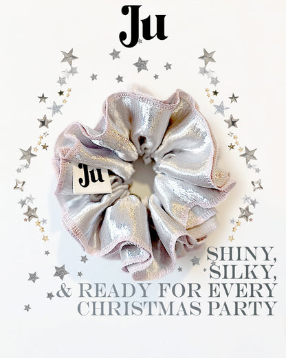 Oversized silver satin scrunchie with soft pink edges, shiny metallic hair accessory for Christmas party or festive hairstyles.