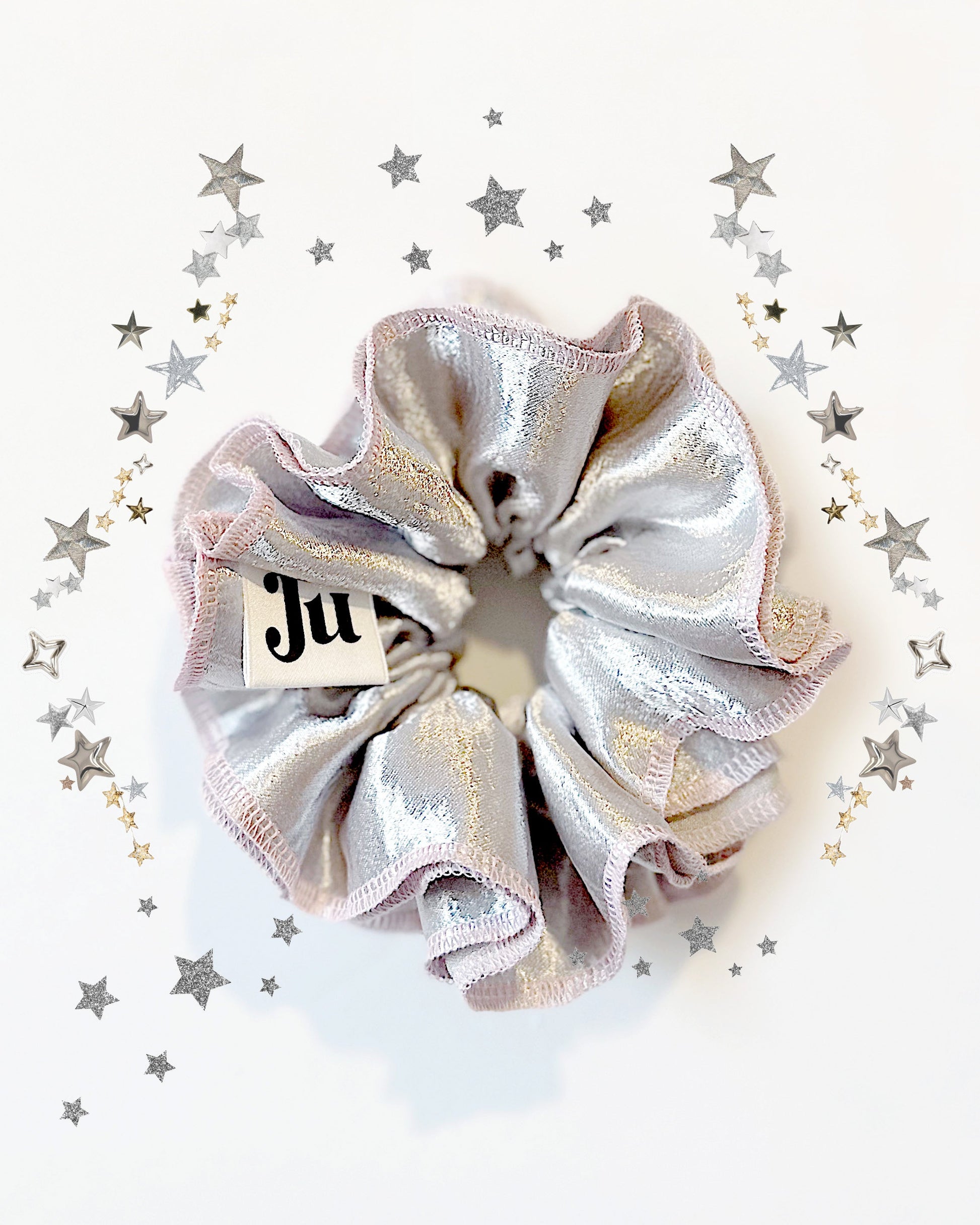 Oversized silver satin scrunchie with soft pink edges, shiny metallic hair accessory for Christmas party or festive hairstyles.