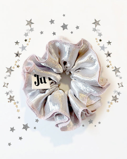 Oversized silver satin scrunchie with soft pink edges, shiny metallic hair accessory for Christmas party or festive hairstyles.